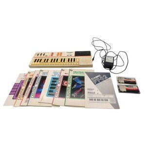 Casio PT-82 Keyboard with Books and ROM Cartridges Vintage 1980s Tested Works